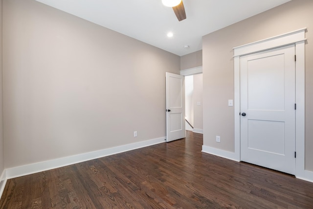 unfurnished bedroom with a ceiling fan, dark wood finished floors, recessed lighting, a closet, and baseboards