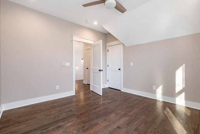 additional living space featuring dark wood-type flooring, lofted ceiling, recessed lighting, baseboards, and ceiling fan