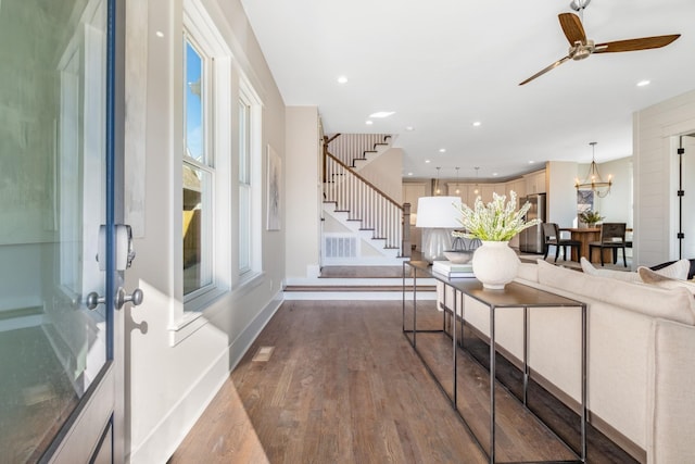 interior space with baseboards, stairway, recessed lighting, wood finished floors, and a ceiling fan