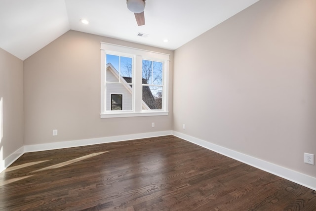 additional living space with a ceiling fan, baseboards, visible vents, lofted ceiling, and dark wood-type flooring