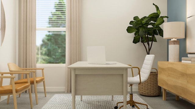 dining area featuring carpet flooring and baseboards