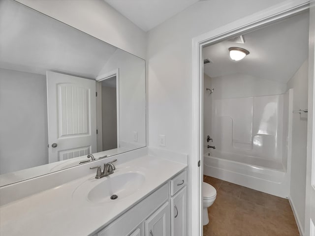 bathroom featuring toilet, shower / washtub combination, tile patterned flooring, lofted ceiling, and vanity