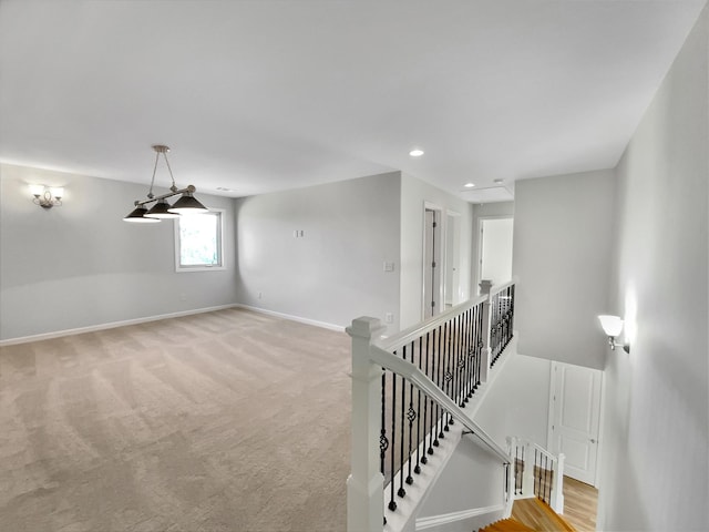 interior space with carpet flooring, recessed lighting, and baseboards