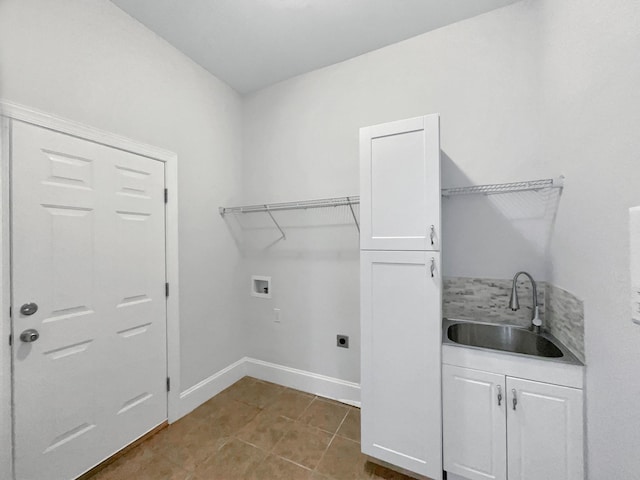 washroom featuring tile patterned floors, washer hookup, a sink, cabinet space, and hookup for an electric dryer