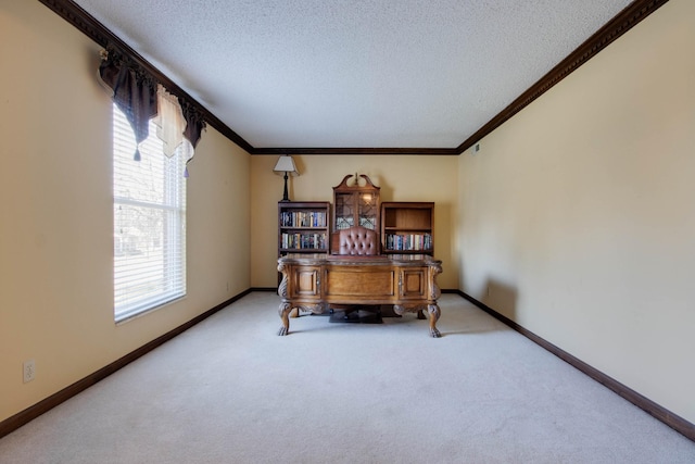 home office featuring carpet floors, a textured ceiling, baseboards, and ornamental molding