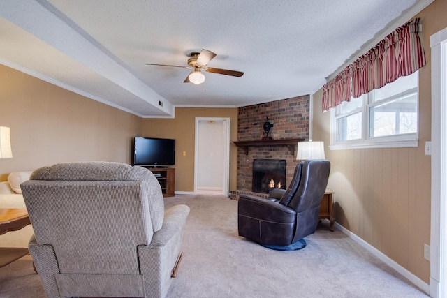 carpeted living room with baseboards, a textured ceiling, a brick fireplace, and ceiling fan