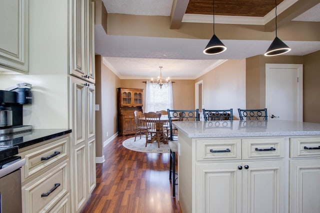 kitchen featuring range, pendant lighting, dark wood finished floors, and crown molding