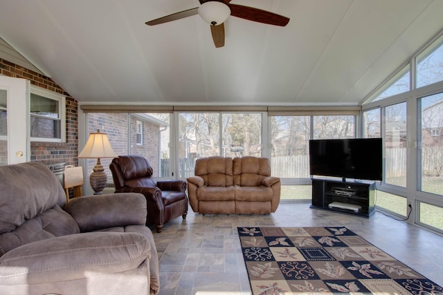 living area with a sunroom and vaulted ceiling