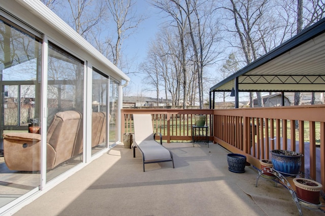 view of patio featuring a sunroom