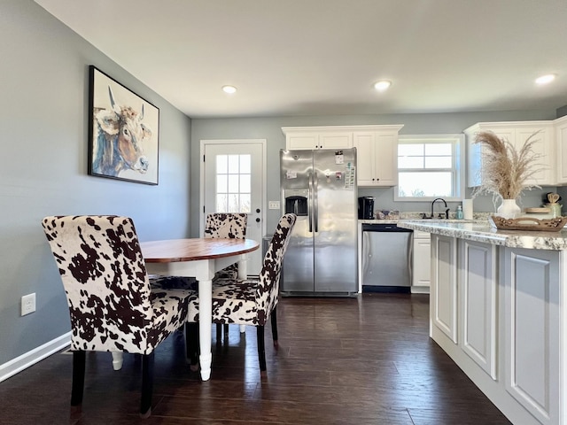 dining area featuring dark wood-type flooring, recessed lighting, and baseboards