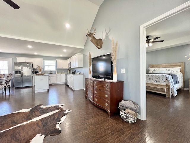 living area with ceiling fan, lofted ceiling, dark wood-style floors, and recessed lighting