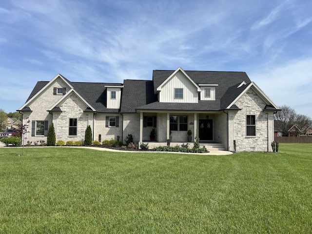 view of front of home featuring covered porch, board and batten siding, and a front lawn