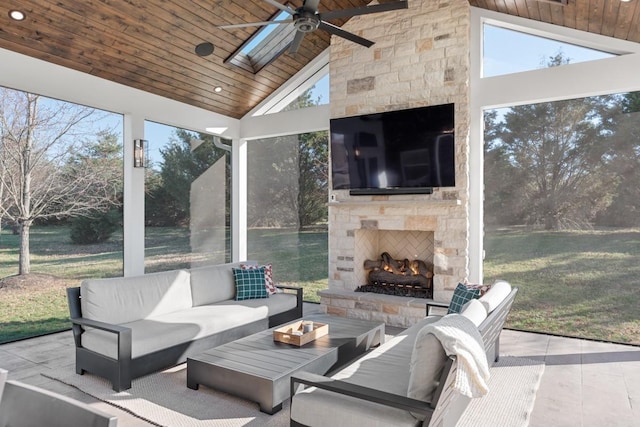 sunroom / solarium featuring vaulted ceiling, wood ceiling, and a wealth of natural light