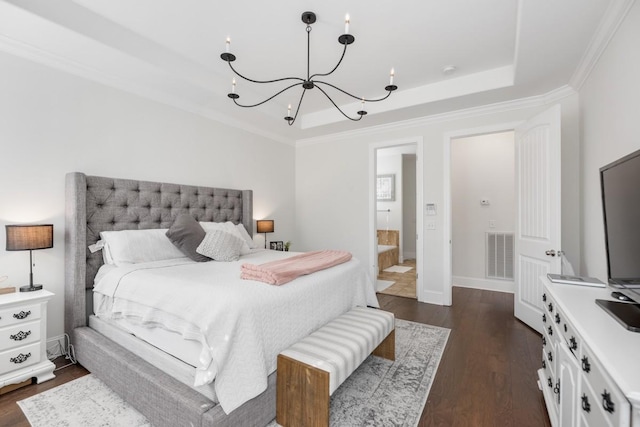 bedroom with visible vents, a raised ceiling, a notable chandelier, and dark wood finished floors