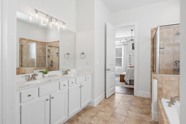 ensuite bathroom with a sink, ensuite bath, double vanity, and a tile shower