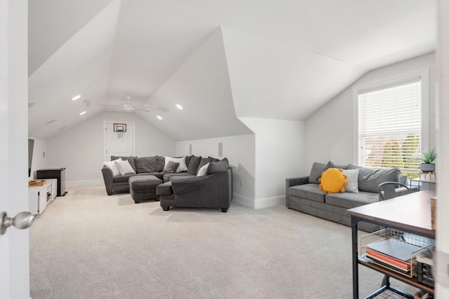 living area featuring lofted ceiling, baseboards, carpet floors, and ceiling fan