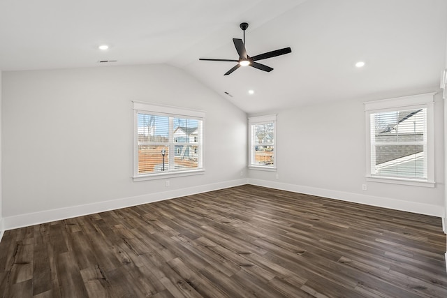 unfurnished room featuring a ceiling fan, lofted ceiling, baseboards, and dark wood-style flooring