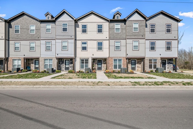 multi unit property with central AC unit and brick siding