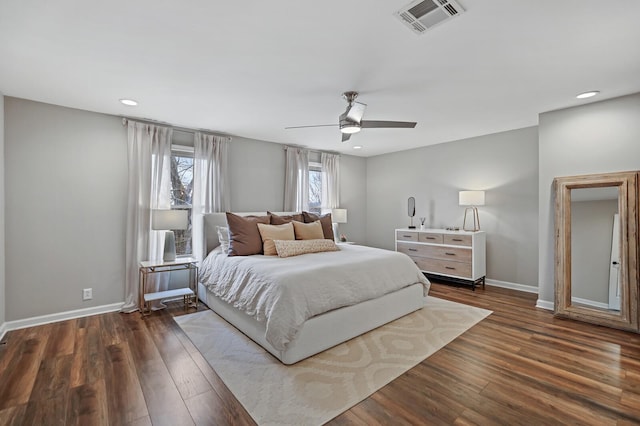 bedroom featuring recessed lighting, visible vents, baseboards, and dark wood-type flooring