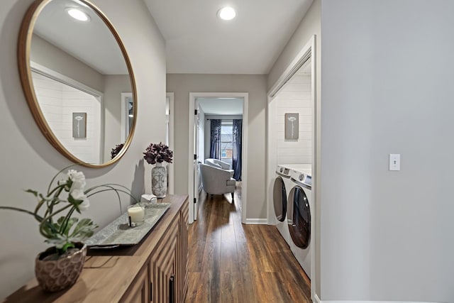 laundry area with dark wood-type flooring, baseboards, washing machine and dryer, laundry area, and recessed lighting