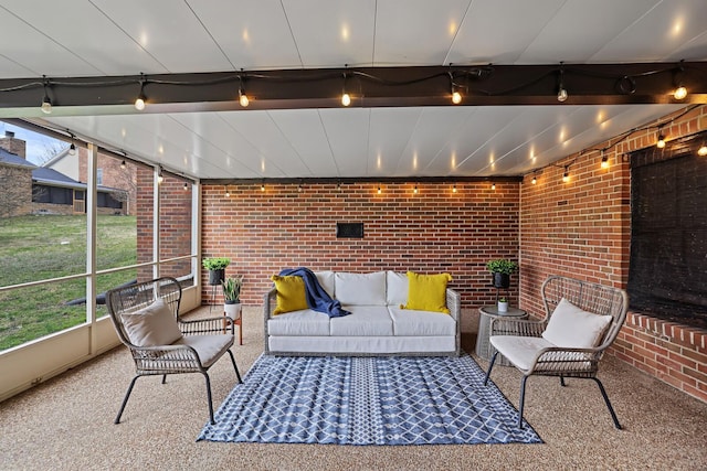 sunroom / solarium featuring beam ceiling