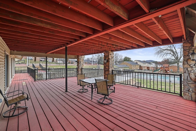 deck featuring a residential view and a playground