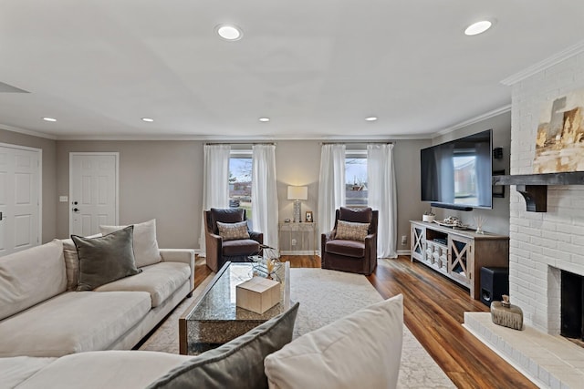 living room featuring dark wood finished floors, a brick fireplace, and recessed lighting