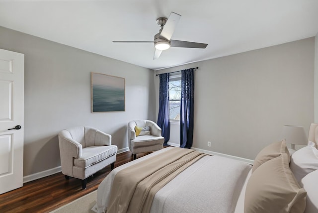 bedroom featuring dark wood-style floors, ceiling fan, and baseboards