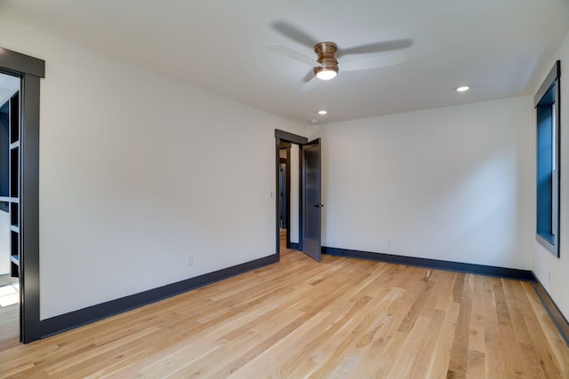 empty room featuring recessed lighting, baseboards, light wood-style floors, and ceiling fan