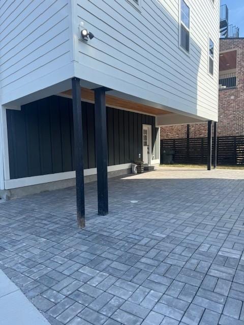 view of patio featuring fence