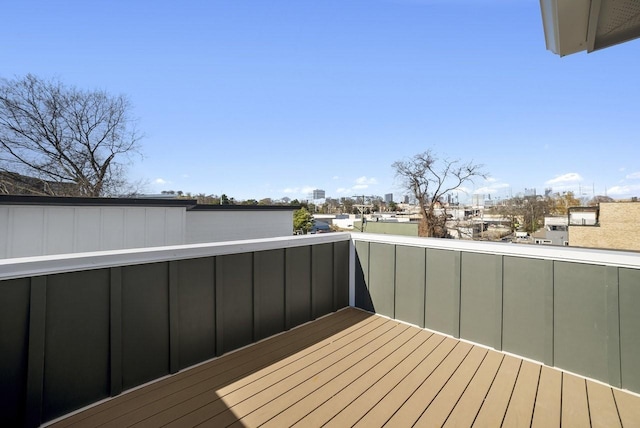 wooden terrace featuring a view of city