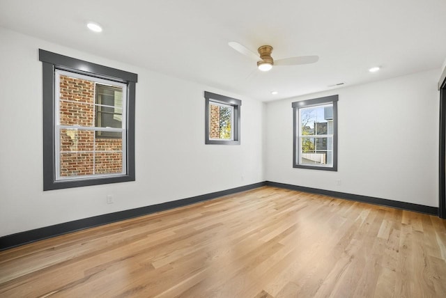 empty room featuring recessed lighting, baseboards, light wood-style floors, and a ceiling fan