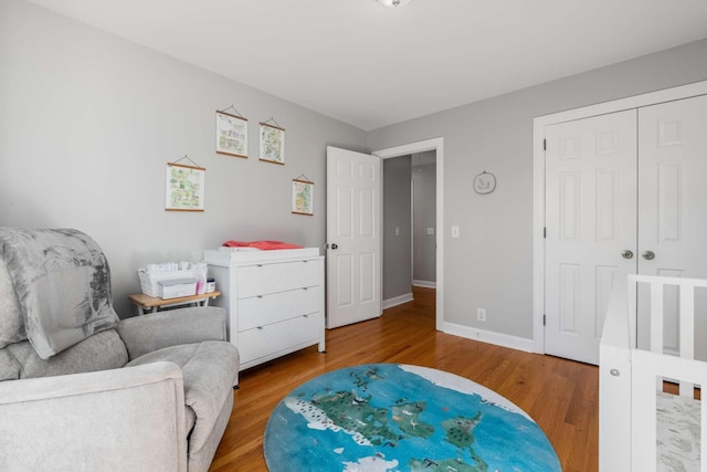 interior space with baseboards and wood finished floors