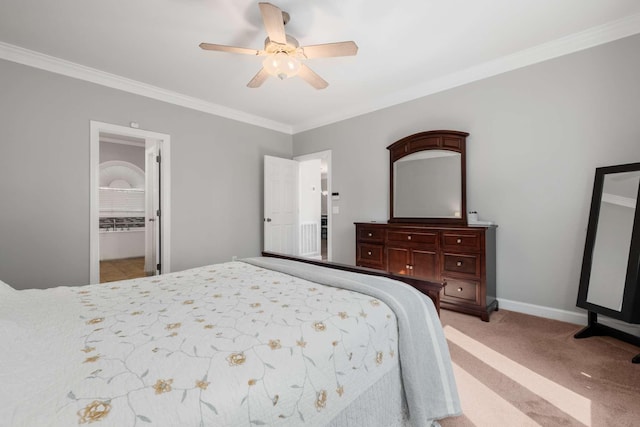 bedroom featuring ceiling fan, crown molding, baseboards, and carpet floors