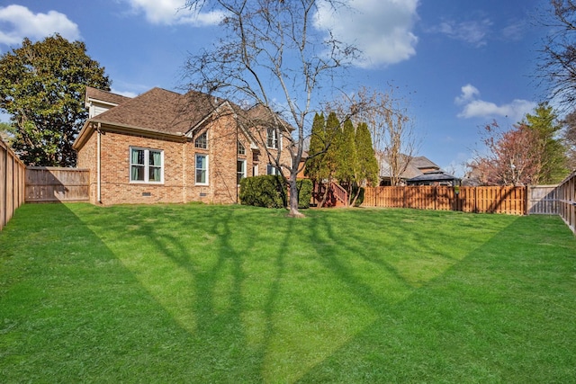 view of yard featuring a fenced backyard