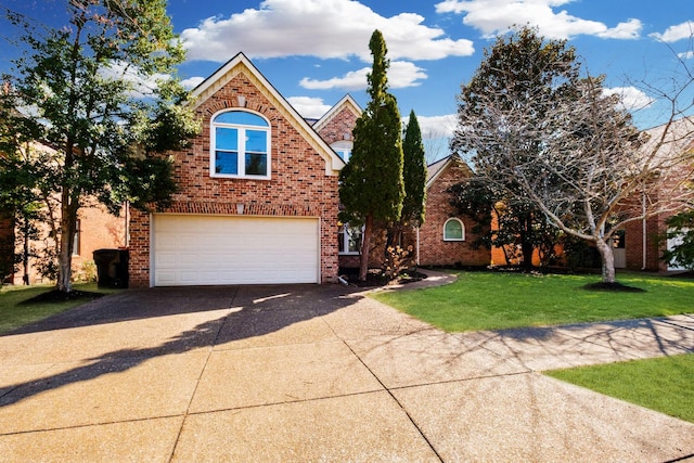 traditional-style home featuring brick siding, a garage, driveway, and a front yard