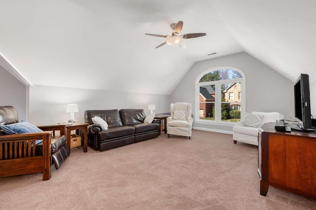 living room with ceiling fan, vaulted ceiling, visible vents, and light carpet