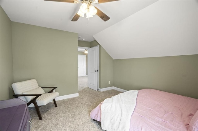 bedroom featuring baseboards, a ceiling fan, lofted ceiling, and carpet flooring