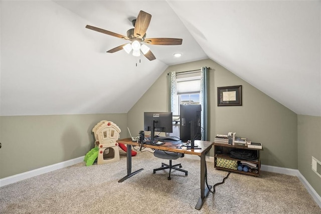 office area with baseboards, lofted ceiling, and carpet