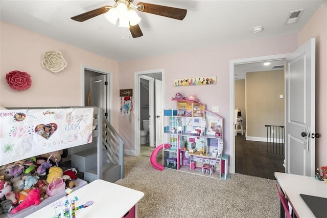 carpeted bedroom featuring visible vents, baseboards, and ceiling fan