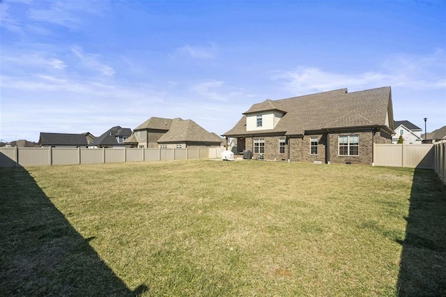 view of yard with a fenced backyard