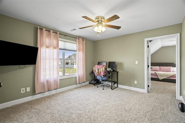 carpeted office with visible vents, baseboards, and ceiling fan