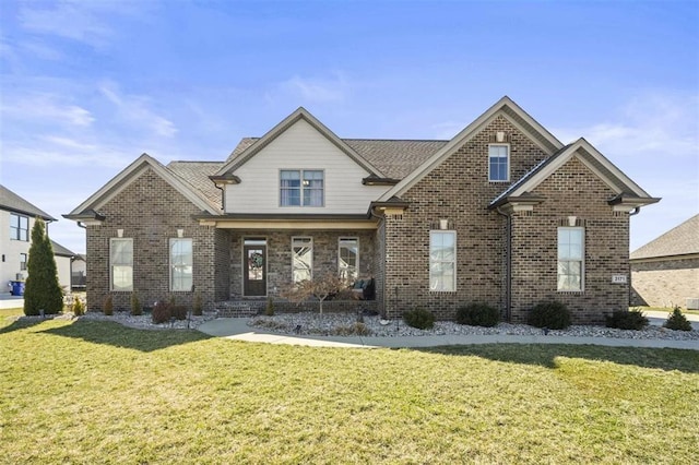 craftsman inspired home with brick siding and a front yard