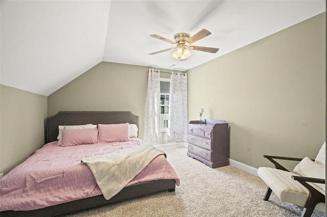 carpeted bedroom featuring baseboards, a ceiling fan, and vaulted ceiling