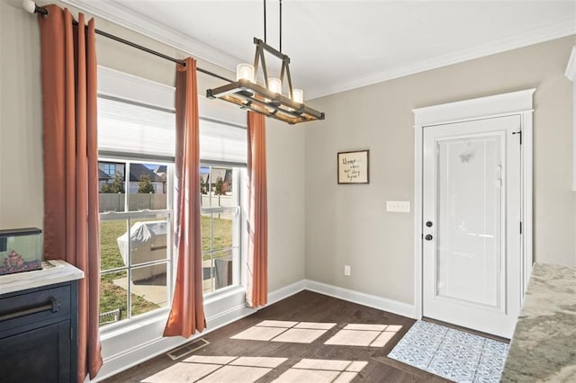 dining area featuring baseboards, visible vents, ornamental molding, dark wood-type flooring, and a notable chandelier