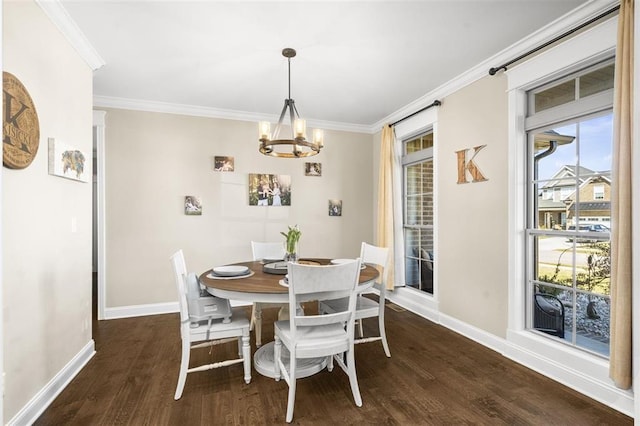 dining room featuring an inviting chandelier, dark wood-type flooring, baseboards, and ornamental molding