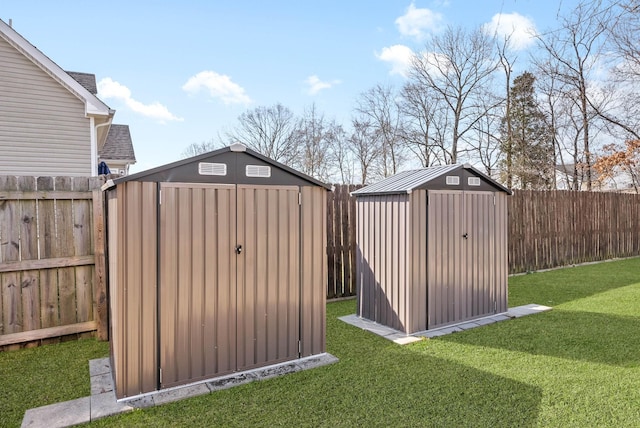 view of shed with a fenced backyard