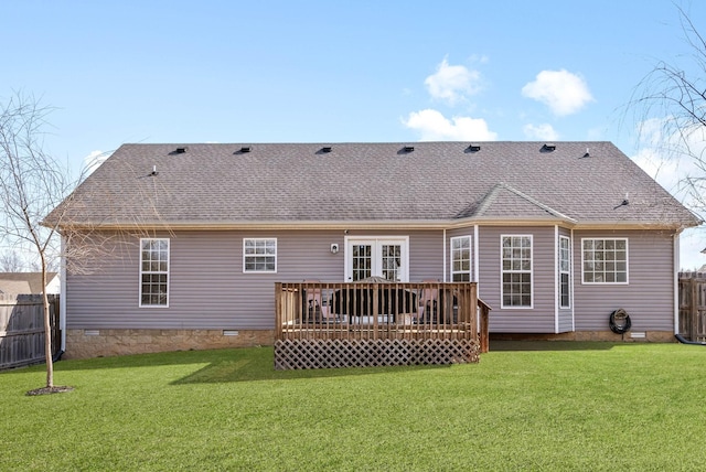 back of house with crawl space, a lawn, roof with shingles, and fence