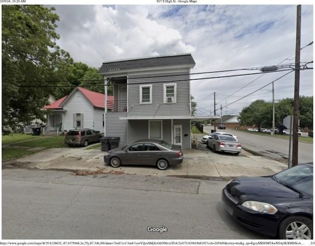 view of front of home featuring a shingled roof