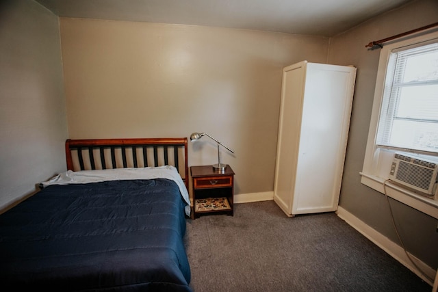 carpeted bedroom featuring cooling unit and baseboards